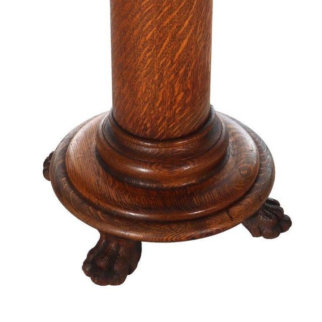 An exceptional antique sculpture stand, attributed to the renowned firm R.J. Horner & Co., crafted from solid quarter-sawn...