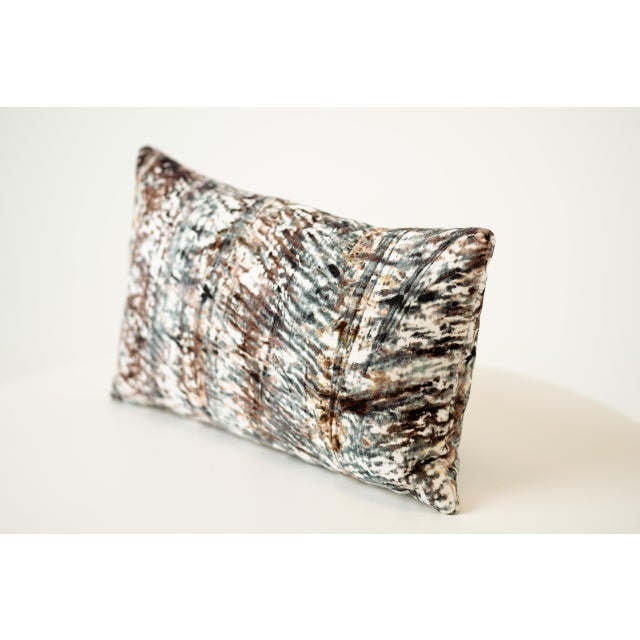 Artistic and expressive, this rectangular lumbar pillow features an abstract painterly pattern in white, brown, and black....