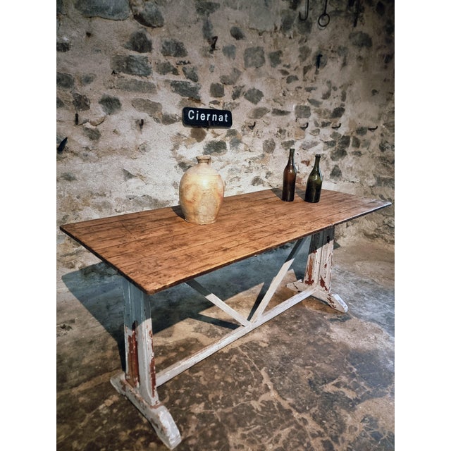 This antique French table from the 1920s is a versatile piece that can serve as both a bistro-style dining table and a...
