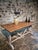This antique French table from the 1920s is a versatile piece that can serve as both a bistro-style dining table and a...