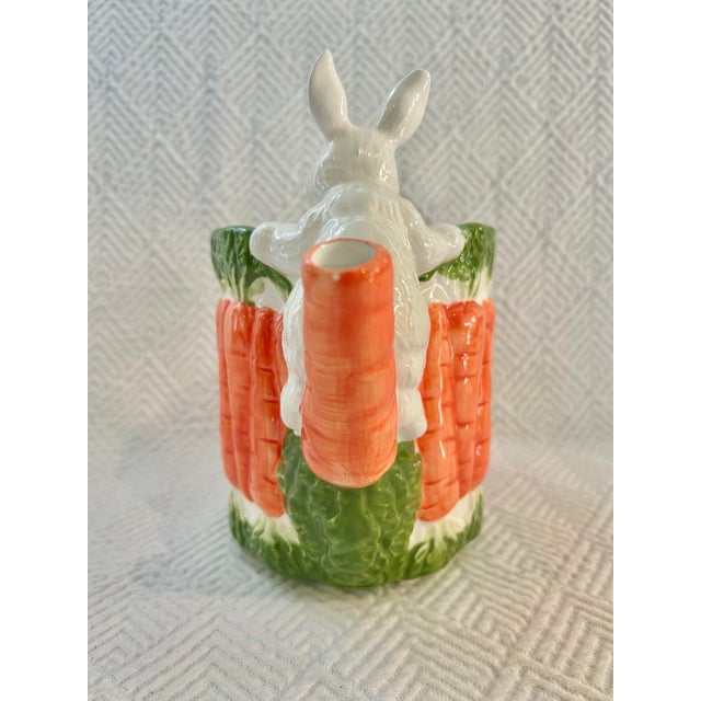 This majolica style bunny rabbit is climbing a bunch of carrots to form a whimsical pitcher for your spring tablescape or...