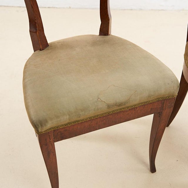Item : pair of neoclassical directory armchairs early 19th century in walnut height: 82 width: 46 seat height: 46...