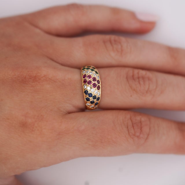 Natural multi-gemstone dome ring in 18K yellow gold featuring 1.21 carat total weight rubies, sapphires, emeralds and...