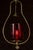 Pendant lamp with a sculptural brass frame in a teardrop outline, housing a ruby red glass shade with diagonal ribbed...
