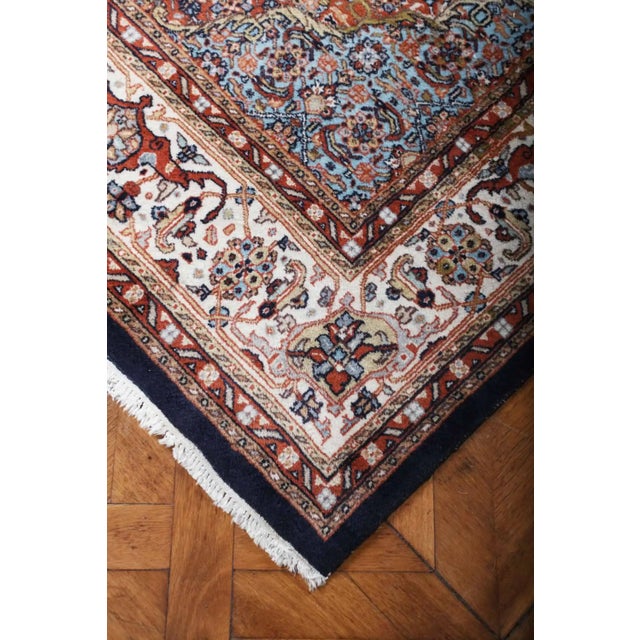 Hand-knotted Indian rug from Jaipur. Central field with herati pattern and central medallion with palmettes. Stylized...