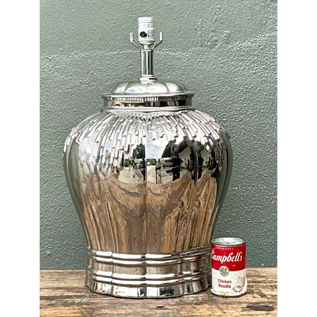 This vintage ceramic table lamp takes a classic baluster form, its bulbous body swelling generously before tapering into a...