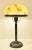 A very simply designed swedish grace/art deco table lamp, made of hand blown glass and bronze patinated brass. The lamp...