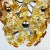 Mid-century amber Murano chandelier with flowers from Mazzega was made in Italy in the 1970s. The glass parts are made of...