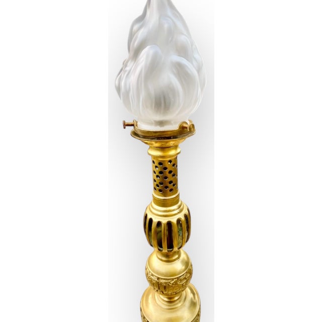 A mid-century modern James Mont-style solid cast, gilt brass table lamp base with Chinese archaistic motifs. It features...