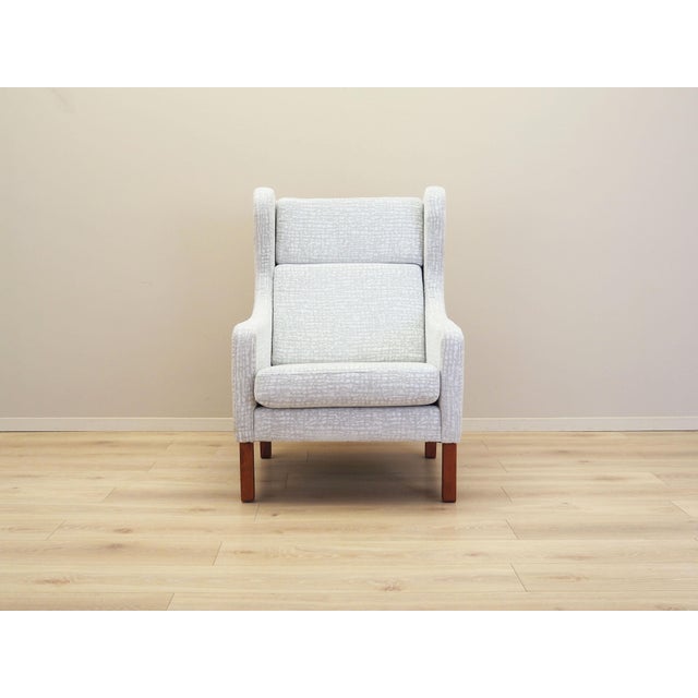 The armchair was made in the 1960s, Danish production. The structure is made of solid wood. Legs made of beech wood. Wood...