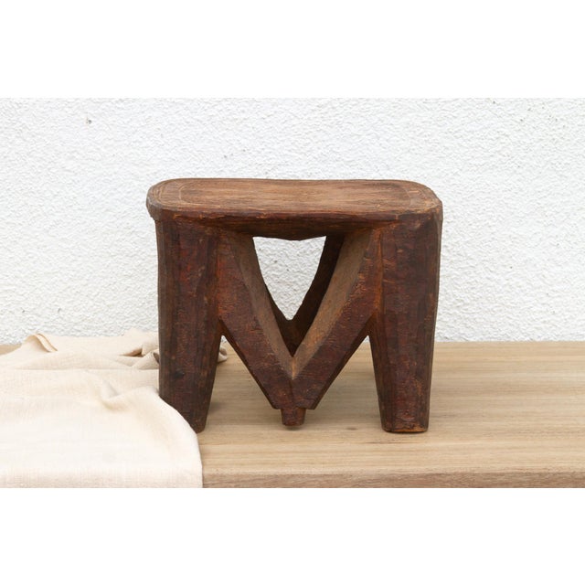A unique piece of African art, this vintage Nupe table from Nigeria is a must-have for collectors and enthusiasts of Nupe...