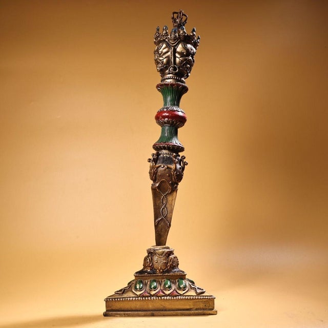 This is a highly ornate gilt copper ritual implement, known as a Phurba (or Kila), presented with its original matching...