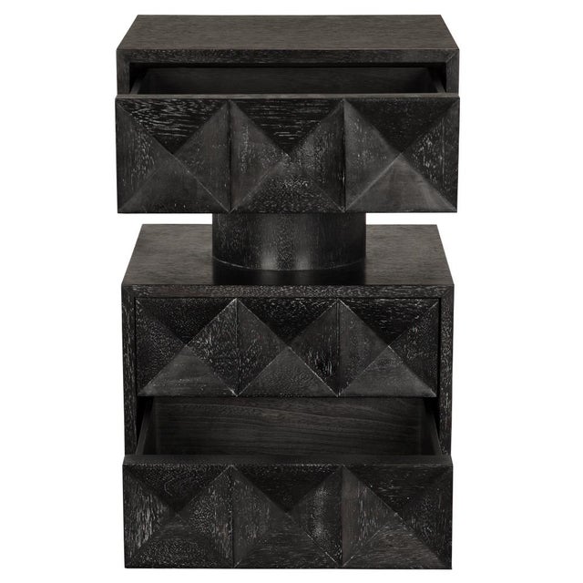 This side table showcases a striking design with geometric diamond-patterned drawers, finished in Black Walnut. Its...