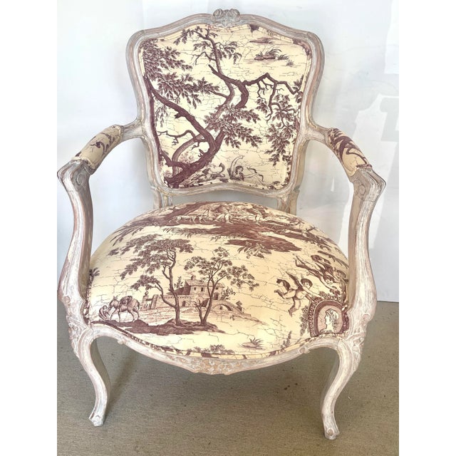 Pair of 19th Century, Louis XV style, "Cabriolet" armchairs recently painted in a Off-white ceruse finish and waxed. This...
