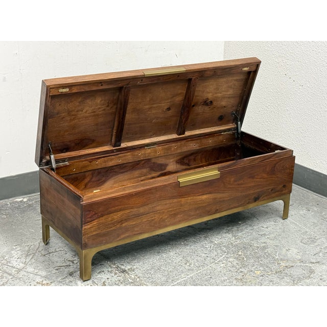 Design Plus Gallery presents the Jada Trunk from Crate & Barrel. The rectangular chest is raised off the ground by slender...