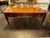 This product is a large 19th-century French Louis XVI walnut bureau plat. This elegant desk features intricate detailing...