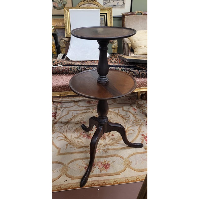 18th century Georgian two-tier dumbwaiter table made of mahogany. Festures two dish-top levels that spin, queen Anne...