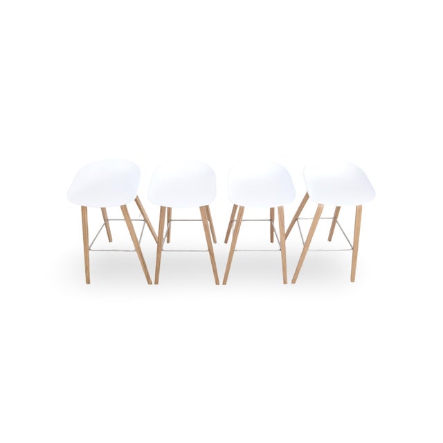 We are offering a beautiful set of four bar stools from the Danish design manufacturer HAY for sale. Designed by Hee...