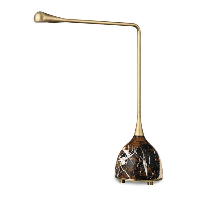 Featuring a richly hued marble base, this distinctive rechargeable lamp showcases dramatic natural veining in warm gold,...