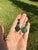 A distinctive pair of circa 1970s vintage articulated drop earrings, composed of richly patterned green malachite set in...
