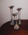 A sculptural set of three bronze candlesticks by Christian de Beaumont, produced in France during the 1980s. Featuring...