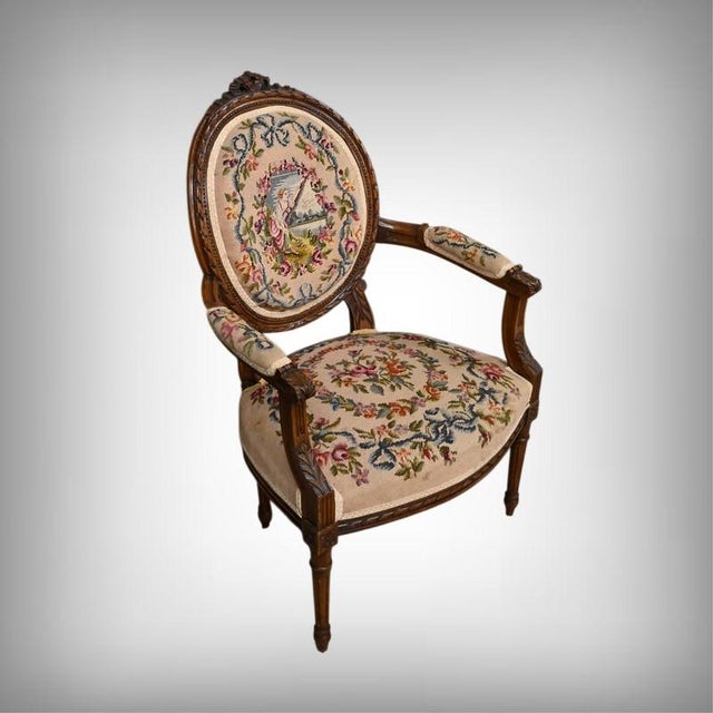 These Louis XVI style armchairs, crafted from stained beechwood, embody the finesse of the last great movement of the 18th...
