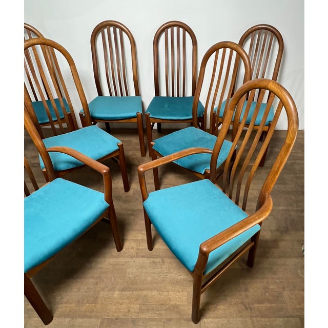 A set of eight vintage 1970s Danish teak high back dining chairs by Schou Andersen, consisting of two arm and six side...