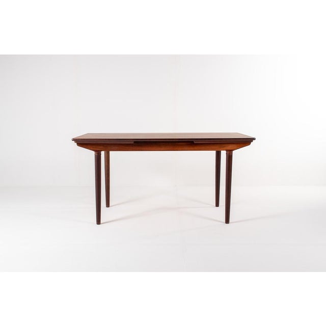Discover this exceptional rosewood extendable dining table designed by Harry Østergaard in the 1960s — an elegant example...