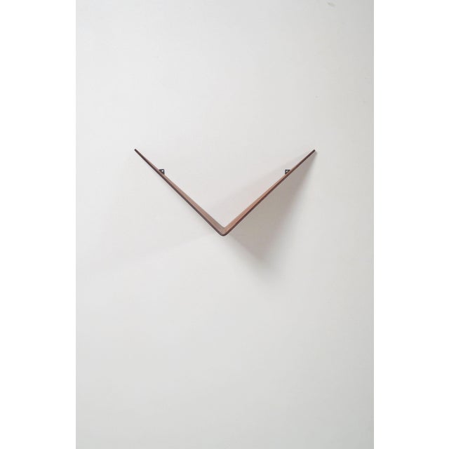 Danish wall shelf Butterfly designed by Poul Cadovius in 1958. It was manufactured by Cado from a single piece of steam-...