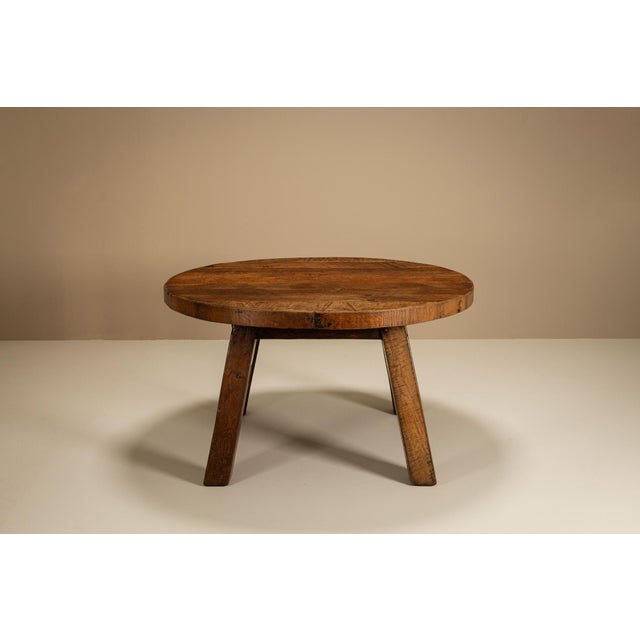 Honest in construction and weighty in presence, this Brutalist round dining table embodies a quiet strength. Its design...