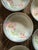 A lovely set of five vintage German porcelain bowls decorated with soft pink poppy flowers, delicate green foliage, and a...