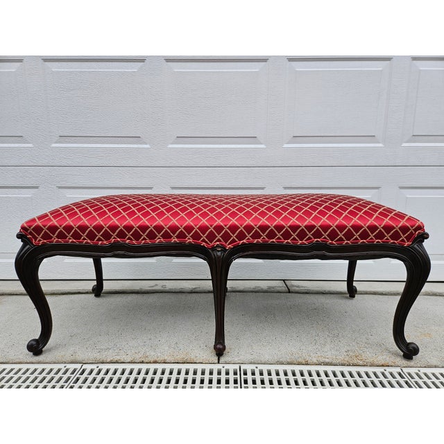 This beautiful French style two-seat bench features red and gold upholstery over a set of six cabriole legs. The bench...