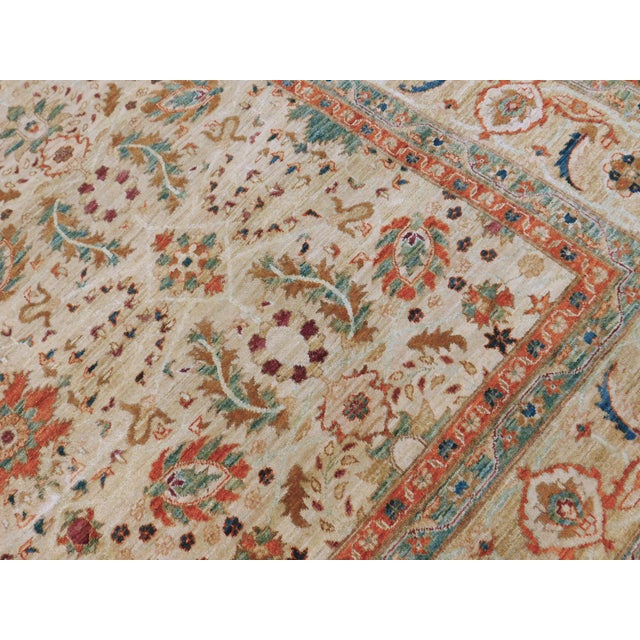 Intricate floral pattern. Soft color palette. Vegetable dye. Wool pile on cotton foundation. Finely woven.