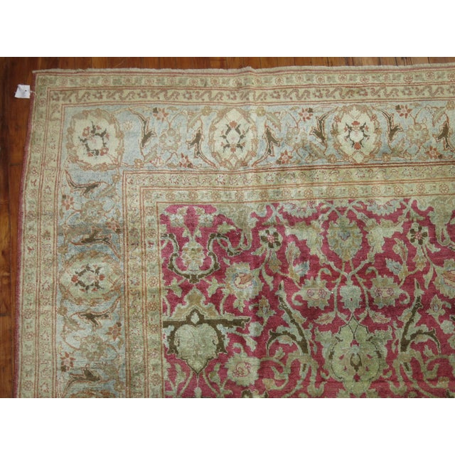 An all-over design Traditional Persian Tabriz rug with a blush raspberry pink ground and gray icy blue. The rug has a very...