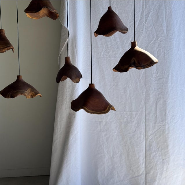 Small organic teak pendant light with a hat-shaped design. Elegant and decorative, organic, with beautiful natural wood...