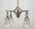 This fixture features a tall support stem with a mixed brass and nickel finish. The four radiating arms are fitted with...