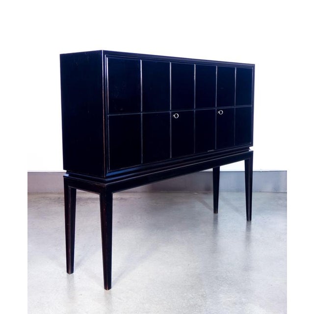 Sideboard, designed by paolo buffa. right compartment with drawer and pull-out serving shelf. lacquered wood. origin italy...
