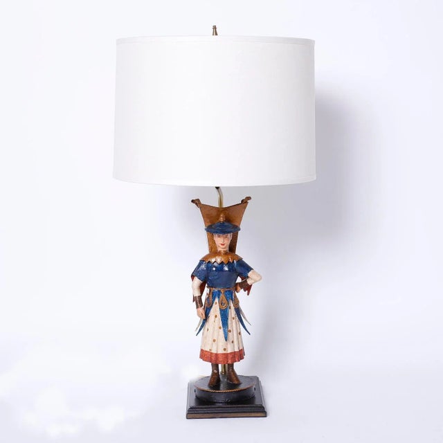 Eccentric pair of vintage tole or painted metal table lamps depicting female and male Asian figures dressed in dramatic...