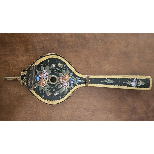 Stunning antique painted fireplace bellows with Flemish, botanical flowers, design and gold gilding on the back. Made of...