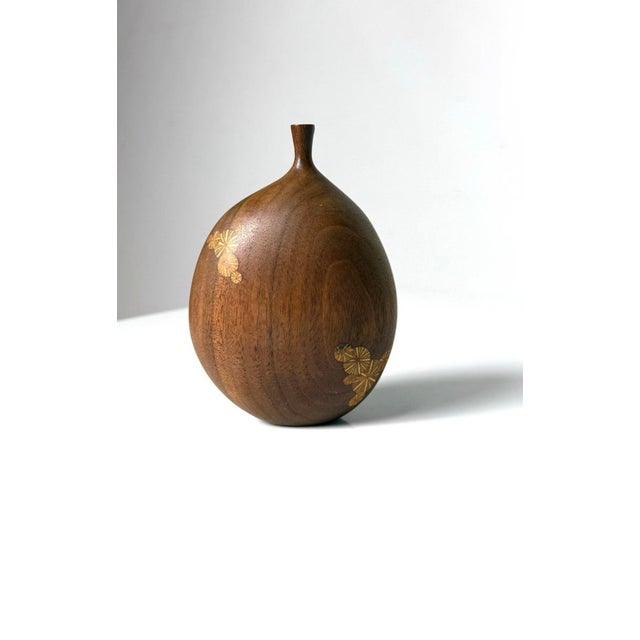 Sculptural turned wood vase by Michigan artist, Roger Sloan, circa 1970s Executed in walnut withSloan's signature inlaid...