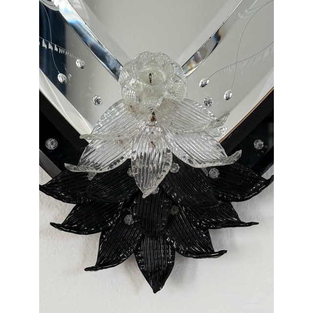 An extra large vintage Murano glass wall mirror featuring a sleek black lacquer frame. This gorgeous Venetian mirror is...