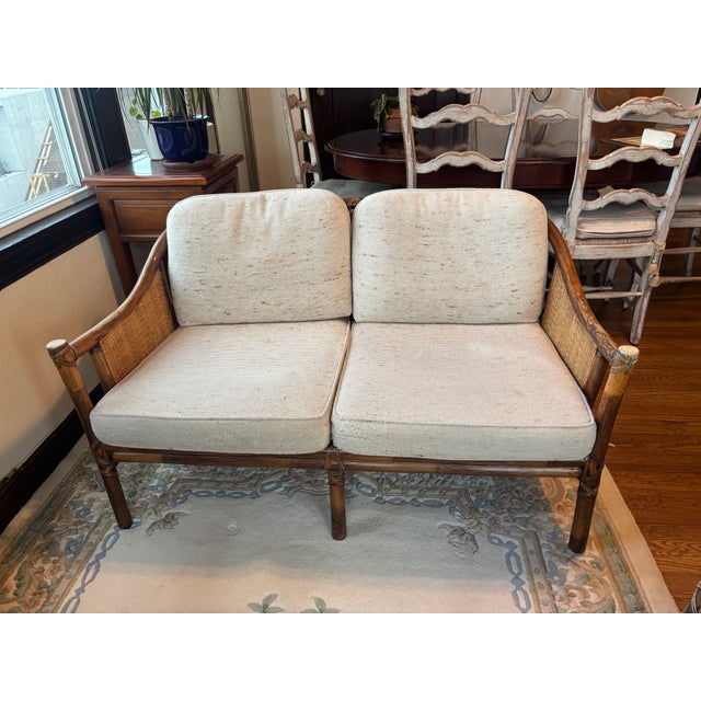 McGuire Mid-Century Modern Rattan Two-Seat Loveseat. Early design by McGuire. Made in USA. All original. Sturdy sculptural...