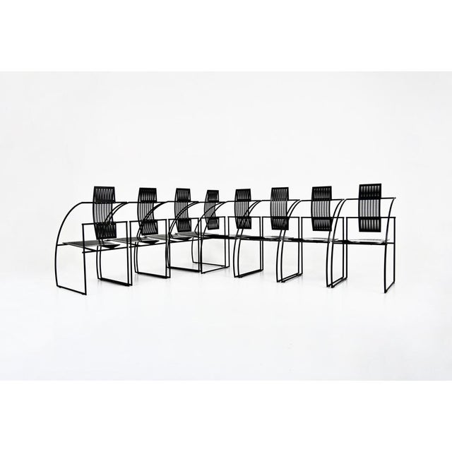 Set of 8 black metal chairs designed by Mario Botta for Alias. Quinta model. Stamped Alias. Seat height: 43 cm. Wear due...