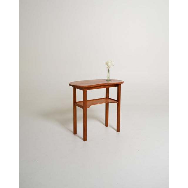 Pine frame with a contoured top and integrated lower shelf. Nordic production, 1950s-1960s. Nordic production from the...