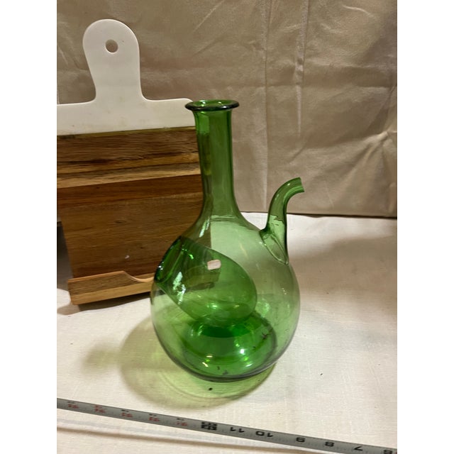 Up for consideration is a beautiful green glass decanter. This would look lovely on display in your home and it is a great...