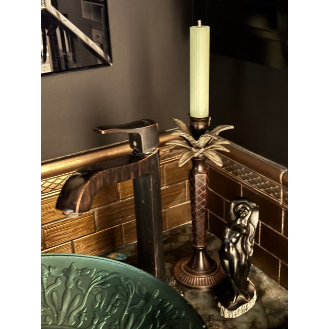 Presenting a substantial weight, high quality vintage enameled metal palm tree candle holder in the manner of Maitland-...