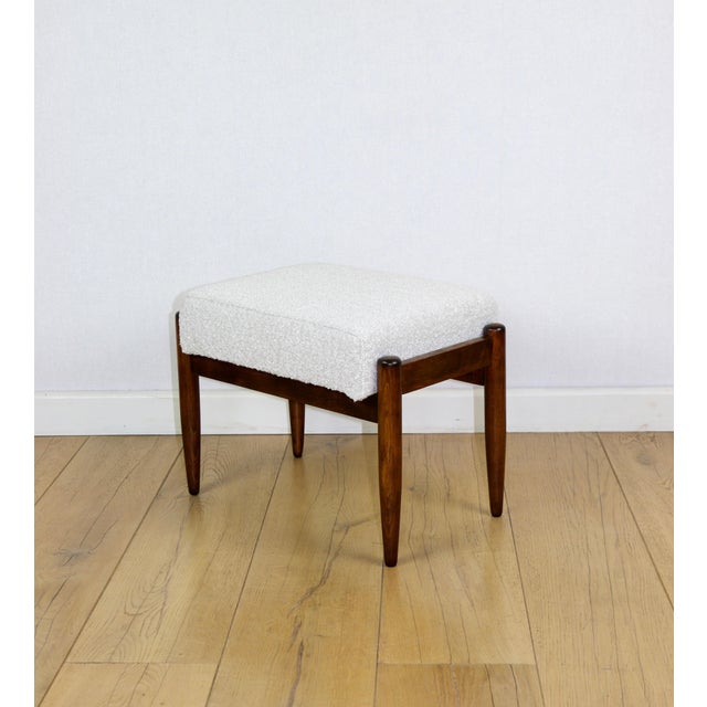 Edmund Homa stool with a cream ivory white boucle seat. 2 pieces available. This stool, designed by Edmund Homa and...