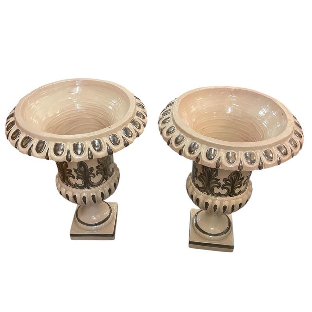 This matching pair features a classic cream-colored glaze accented with hand-painted charcoal and bronze-toned detailing....