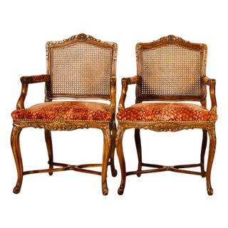 Early 20th Century Pair of Carved Cane-Back Armchairs With Rich Red Upholstery For Sale
