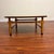 Vintage mid-century coffee table made in the U.S. by Lane in 1959. This piece features a walnut veneer top with inlaid...